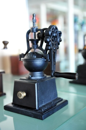 Old coffee grinder on table.の写真素材
