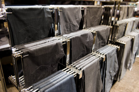 trousers on hangers at the show, for sale. の写真素材