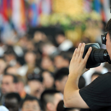Live broadcasting, television operator with camera. Selective focus on hand 
