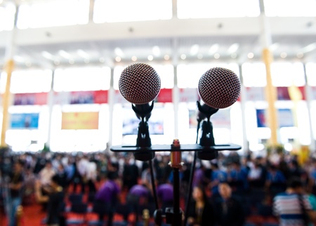 Closeup microphone in auditorium with people.のeditorial素材