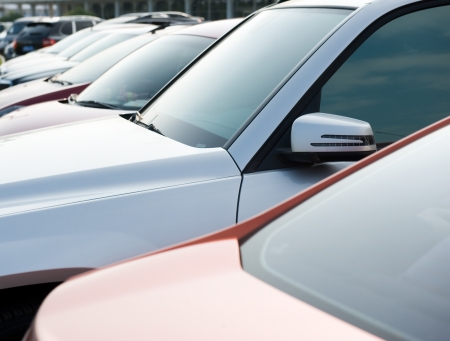 many cars parked in a rowの写真素材