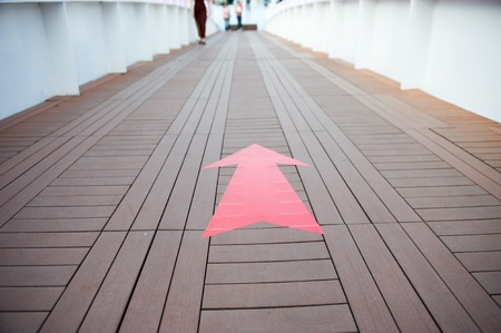 walkway with arrow sign in a bridge. の写真素材