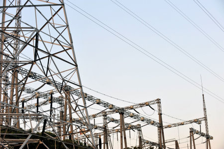 Electric power station against bright sky. 