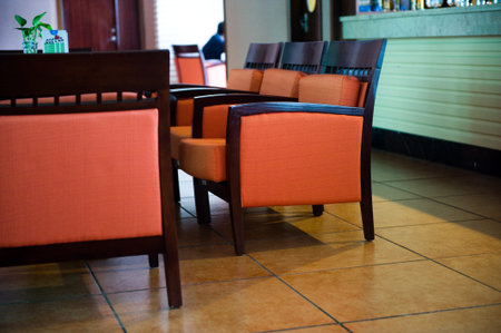 Interior of modern restaurant with orange chairs.のeditorial素材