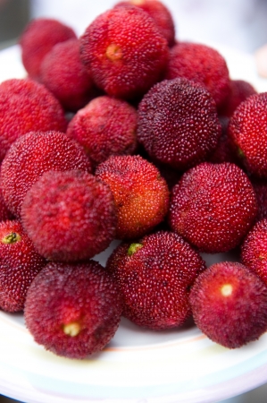 Many ripe waxberry on tray.の写真素材