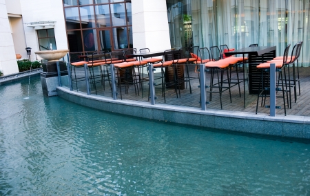 House patio with tables, chairs and pool.のeditorial素材