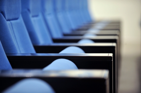 a line of blue theater chairs.の写真素材
