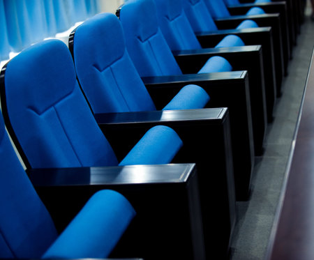 a line of blue theater chairs.