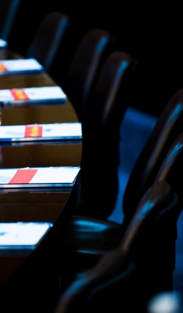 Interior of modern boardroom with black chairs and papers on table. Macro with extremely shallow depth of field
のeditorial素材
