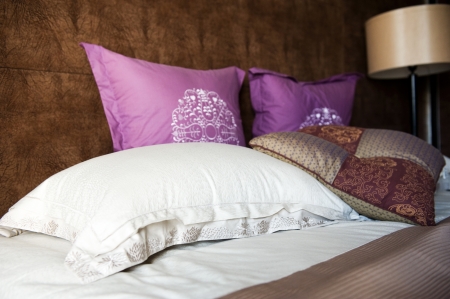 Image of comfortable pillows and bed.の写真素材
