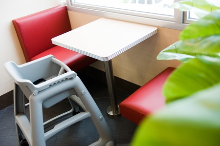 Baby eating chair in a restaurant.のeditorial素材