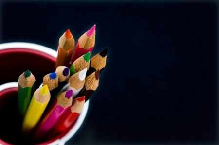 Various Colored Pencils isolated on black background. Macro with extremely shallow depth of field
の写真素材