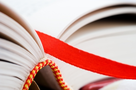 A bookmark in a book helps to find the correct page. Macro with extremely shallow depth of field 
の写真素材