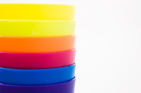 Plastic cups of various color isolated on white. の写真素材