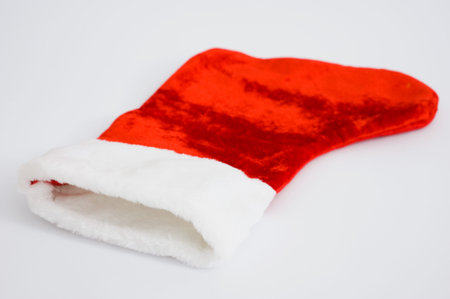 Red and white Christmas stocking shot on white.