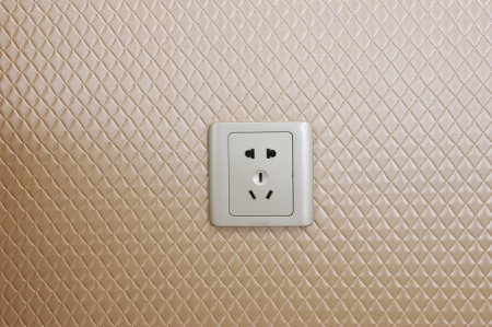 Electric wall plug at a beige wall.
の写真素材