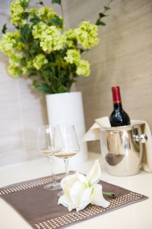 Place setting and flowers on the dining table.の写真素材