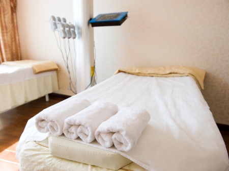 bed in a beauty saloon, with machines for treatments.の写真素材