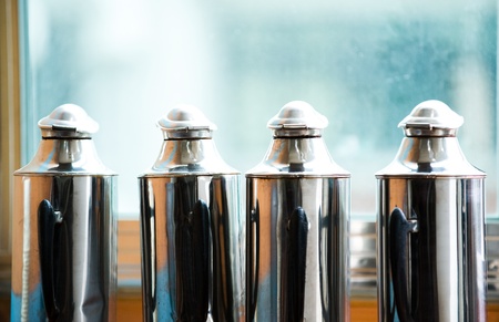 Four tea thermo bottles in a line in China.の写真素材