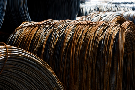 Roll off thick steel fitting, steel background.の写真素材