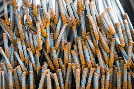 Steel rods or bars used to reinforce concrete.