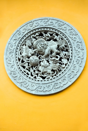 carved stone with lion in Chinese temple.の写真素材