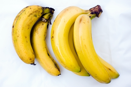 Changing the color of a group of bananas during four days の写真素材