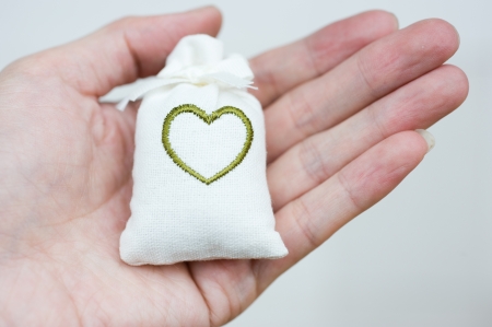 two bag with heart symbol on hand.  の写真素材