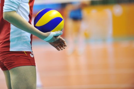 Volleyball player getting ready to serve.の写真素材
