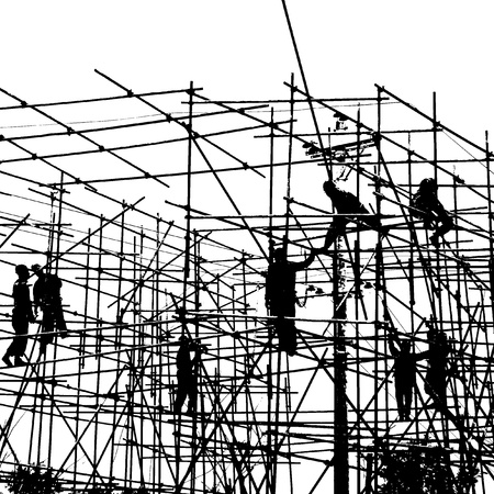Construction workers working on scaffolding の写真素材