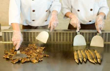 Japanese chef cooking traditional beef and saury teppanyaki on a hot plate. の写真素材