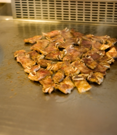 Japanese chef cooking traditional beef teppanyaki on a hot plate. の写真素材