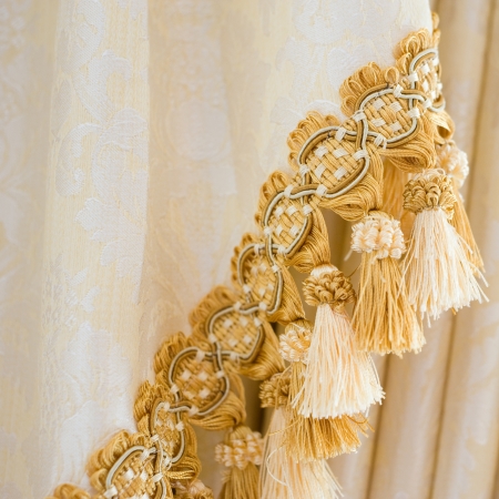 a golden satin decoration background, curtain detail. の写真素材