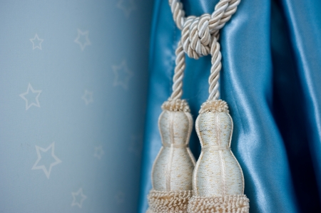 A curtain hold back by tassel の写真素材