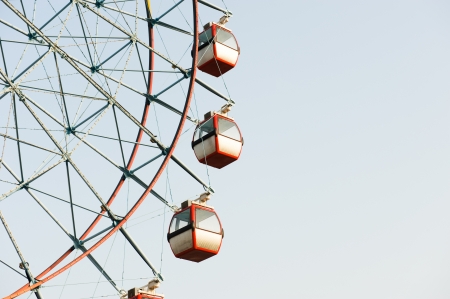 ferris wheel against a blue sky background の写真素材