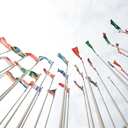 Flags of the world happily blowing in the wind. の写真素材