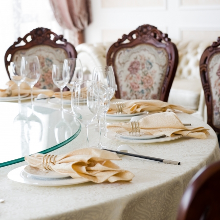 Formal dining room table and chairs set for dinnerの写真素材