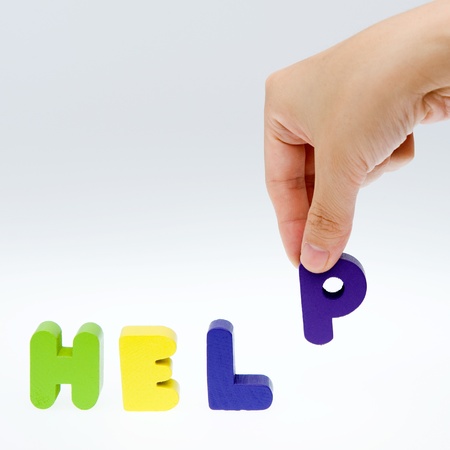 Hand and word  HELP, business concept, isolated on white background の写真素材