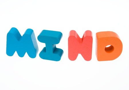 Wooden letters spelling the word  " mind "  on white background. の写真素材