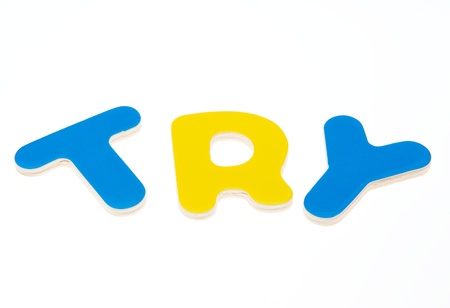 Wooden letters spelling the word  TRY  on white background. の写真素材
