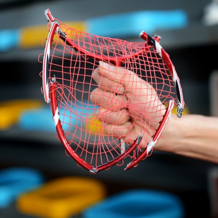 broken badminton racket in hand at badminton courts. の写真素材