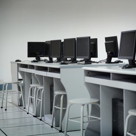 Rows of computer neatly placed in a computer lab. の写真素材