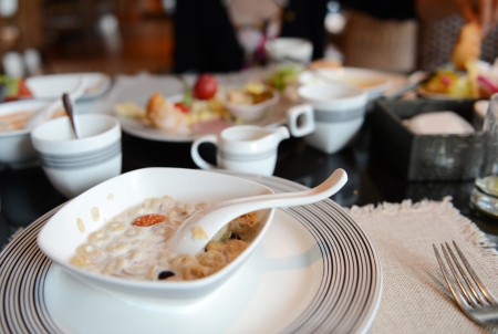 healthy breakfast with cereal flakes, bread and coffeeの写真素材