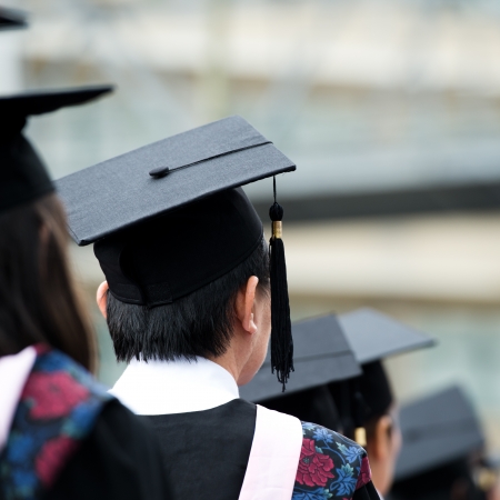 back of graduates during commencement. の写真素材
