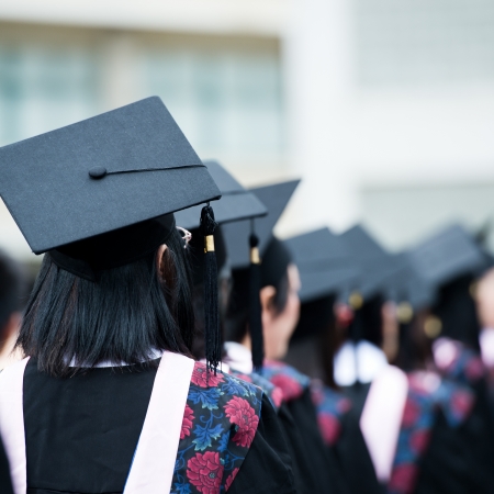 back of graduates during commencement. の写真素材