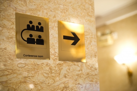conference room sign and direction on wall.の写真素材
