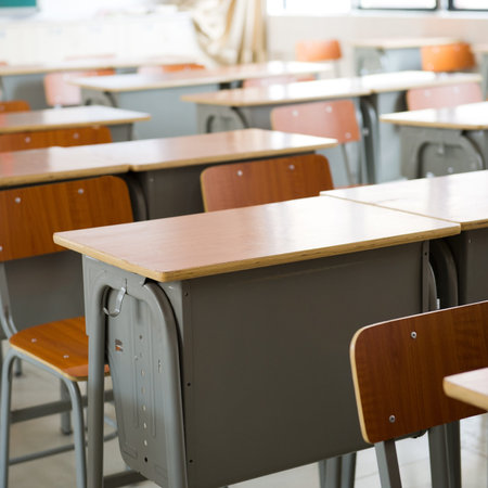 Empty classroom with chairs and desks.
