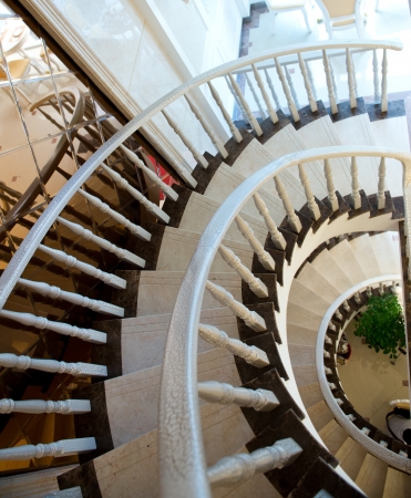 spiral staircase with wooden handrail.の写真素材