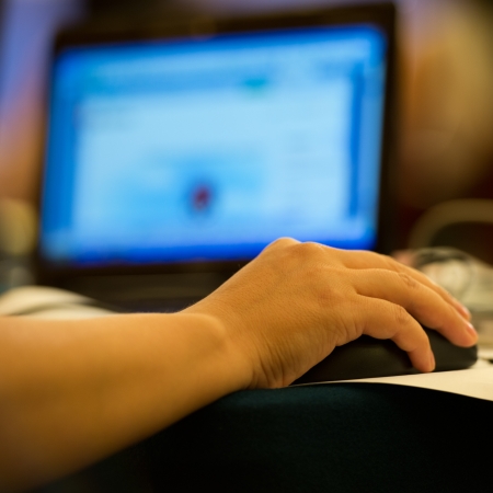 Human hands typing on laptop keyboard.の写真素材