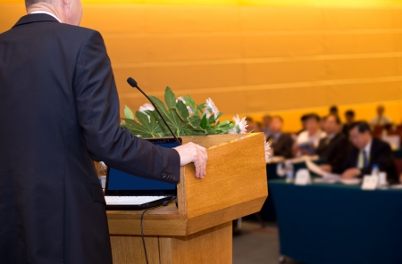 Business man is making a speech in front of a big audience at a conference hall.
の写真素材
